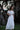 Front view of girls ivory lace formal set with ruffle crop top and maxi skirt
