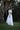 Side angle of girls boho formal outfit – lace skirt and off-shoulder top