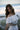 Tween girl wearing Ivory  two-piece set by Tea Princess –off the shoulder lace top and flowy skirt